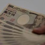 japanese yen bills in hand